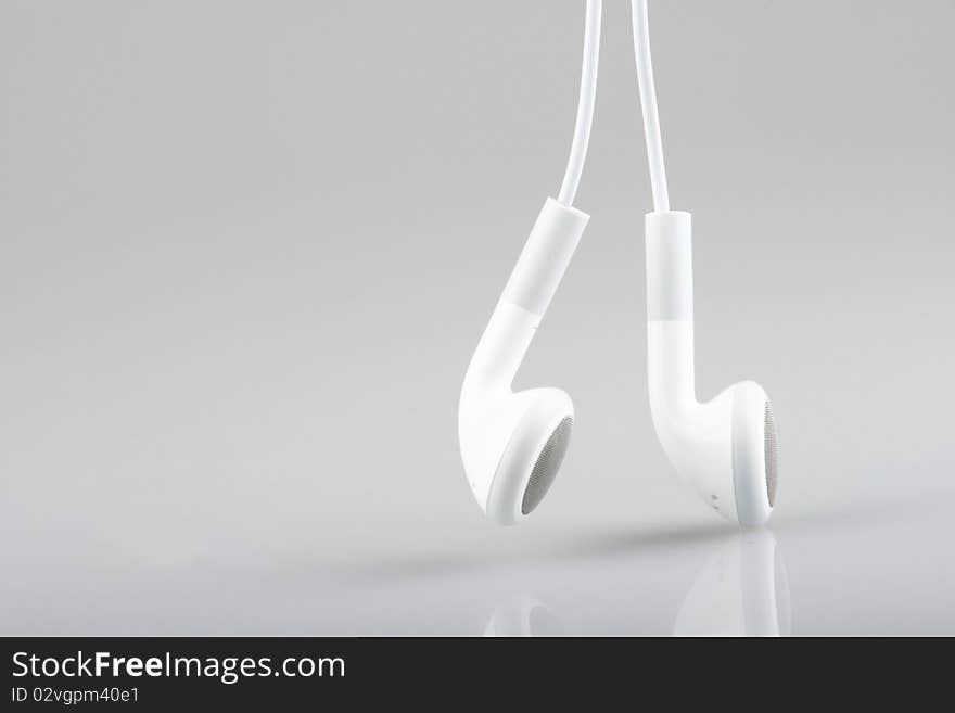 Macro with white earphones isolated