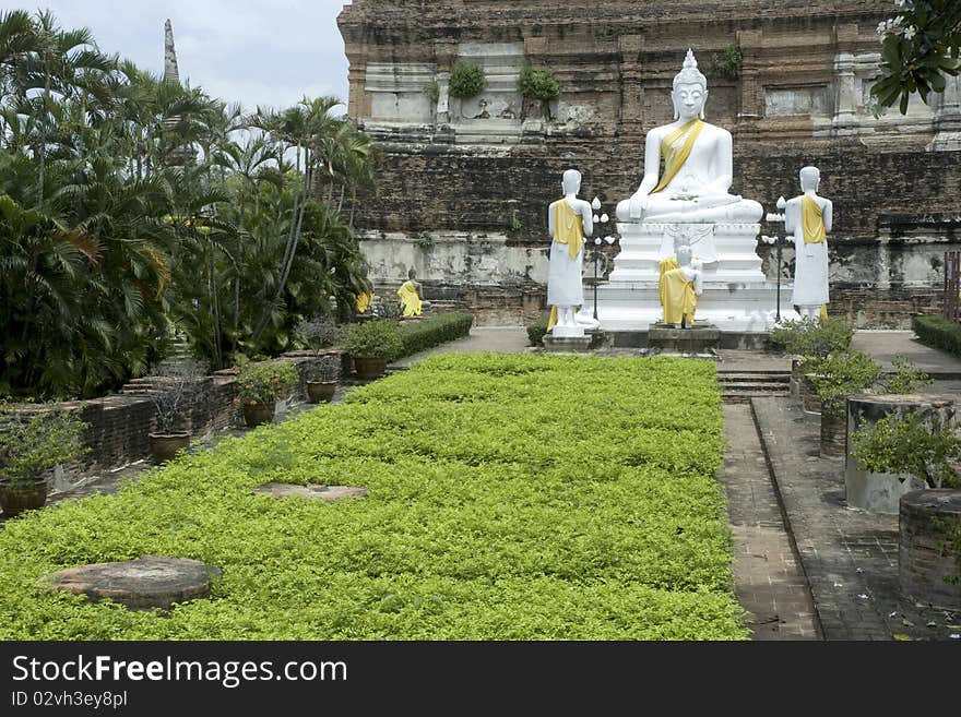 White Buddha in Wat Yai chai Mong kol , Ayutthaya , Thailand. White Buddha in Wat Yai chai Mong kol , Ayutthaya , Thailand.