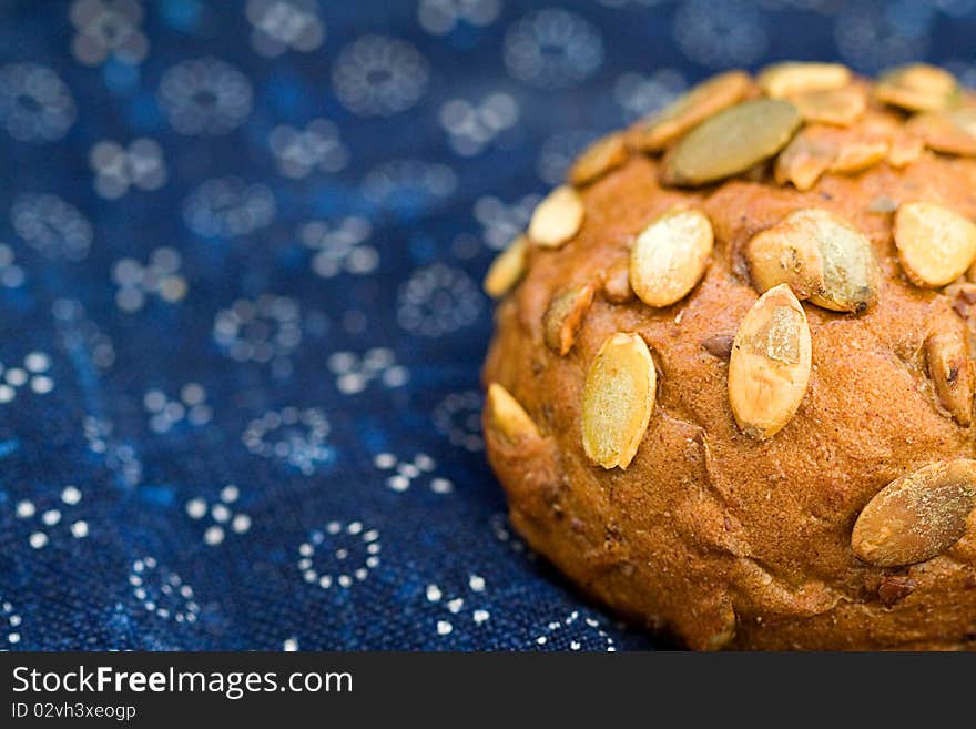 Bread on blue canvas. Macro