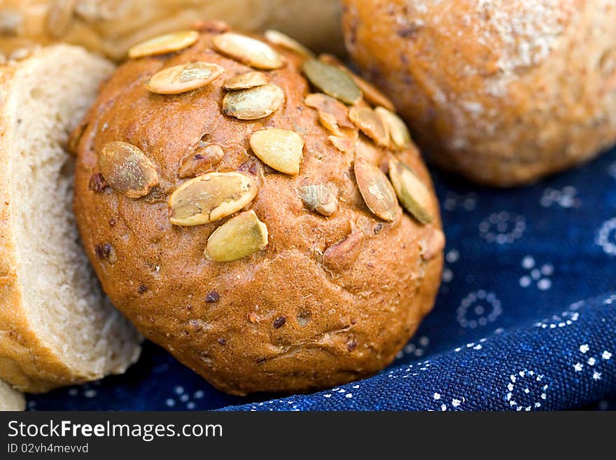 Bread on blue canvas. Macro