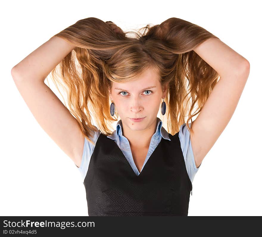 Young woman raises her long hair with his hands