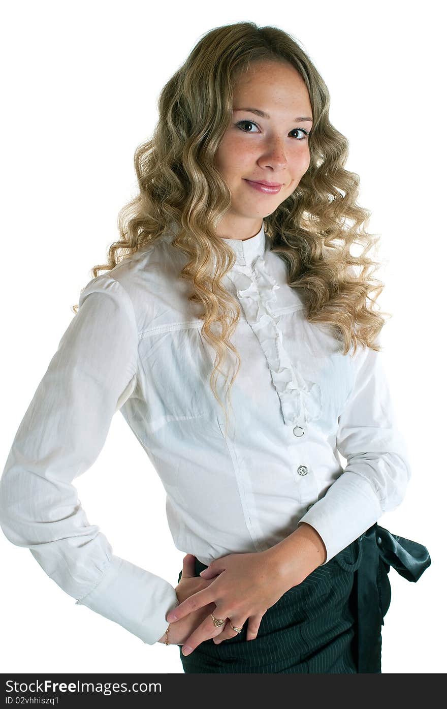 The young beautiful girl in a white shirt and black skirt. Isolation on a white background