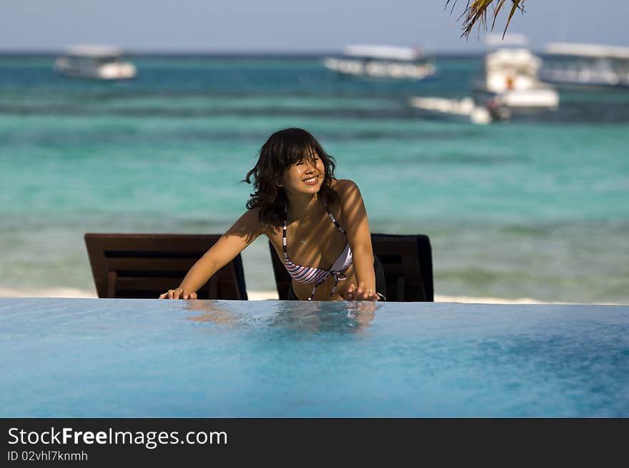 Pretty young woman standing on beach. Pretty young woman standing on beach