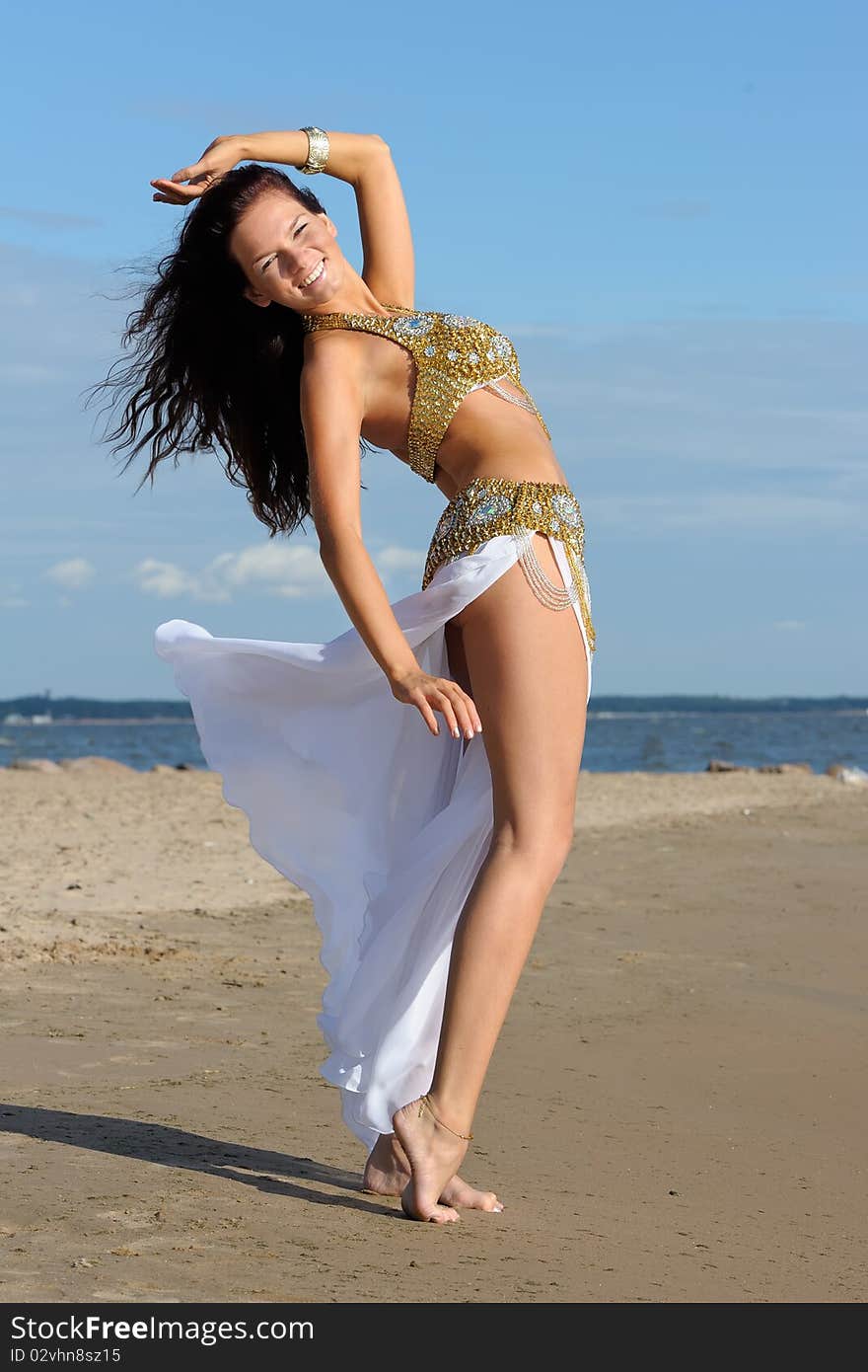 Graceful woman in white exotic dress. Graceful woman in white exotic dress