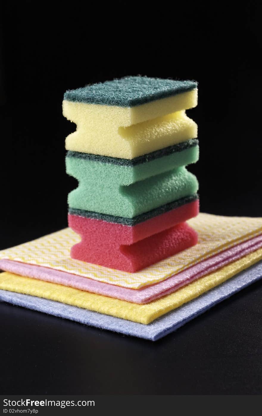 Sponge and napkin on a dark grey background