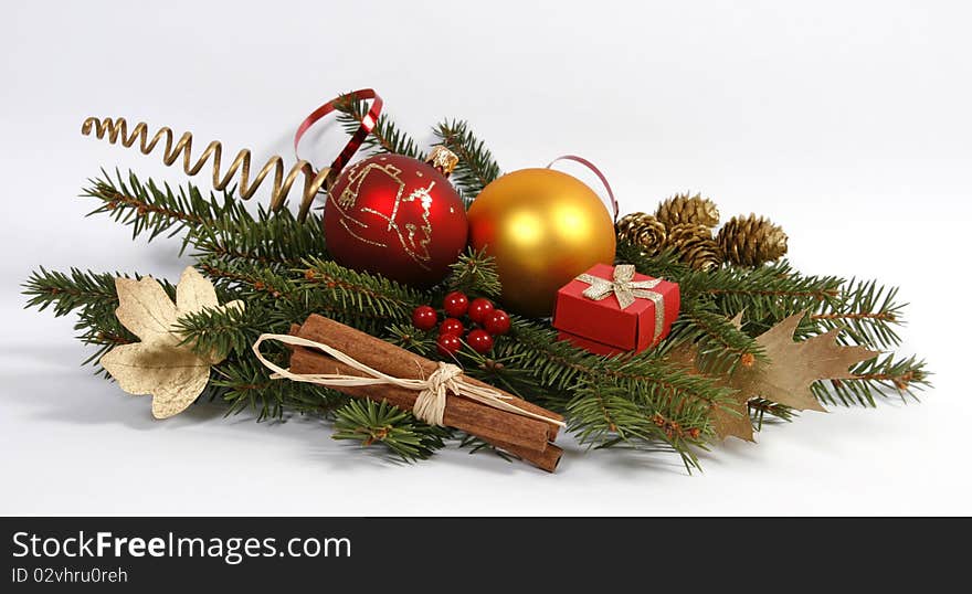 Christmas decoration with the twigs of the spruce and baubles