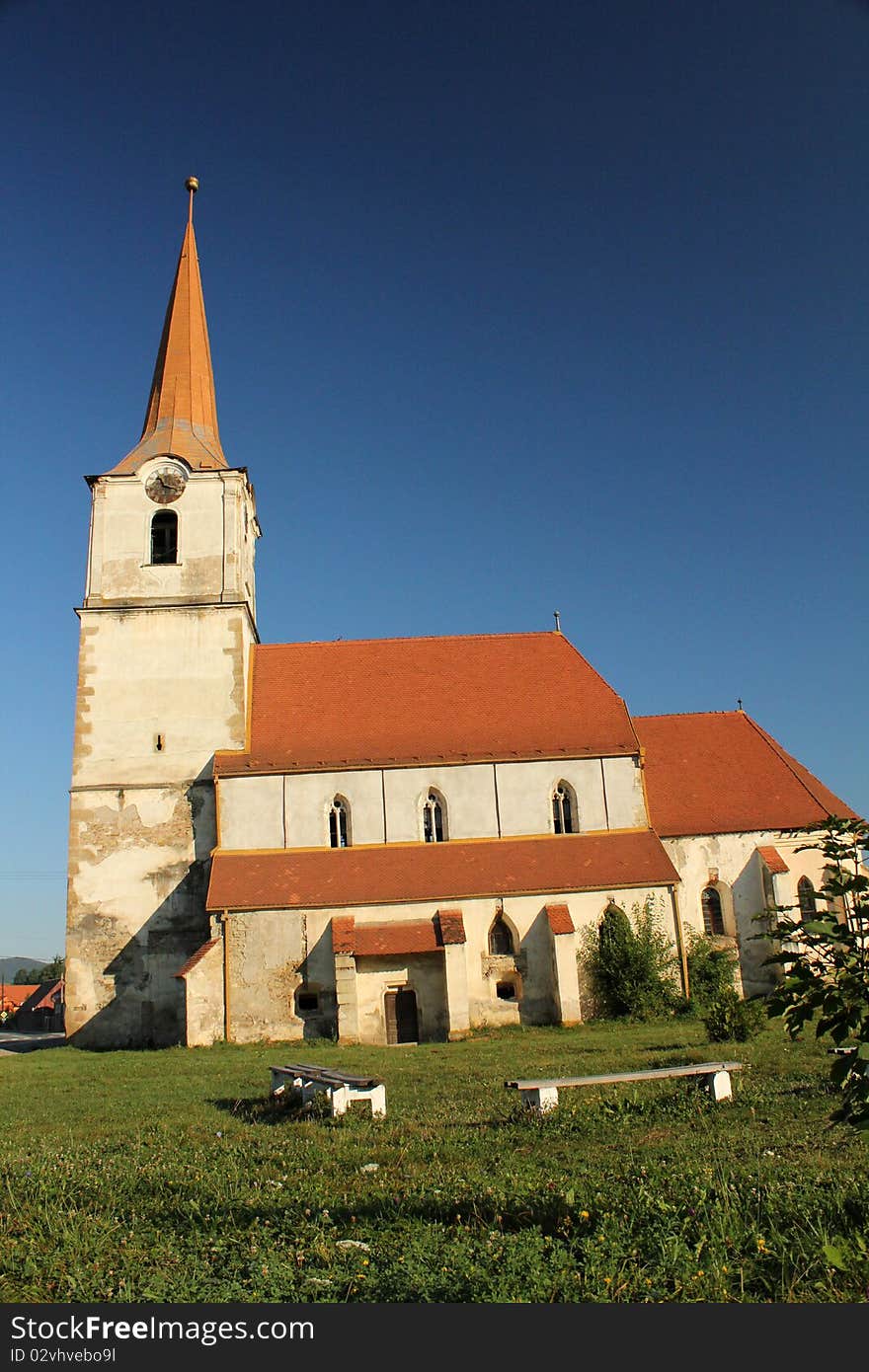 Old medieval church covered with red tile.