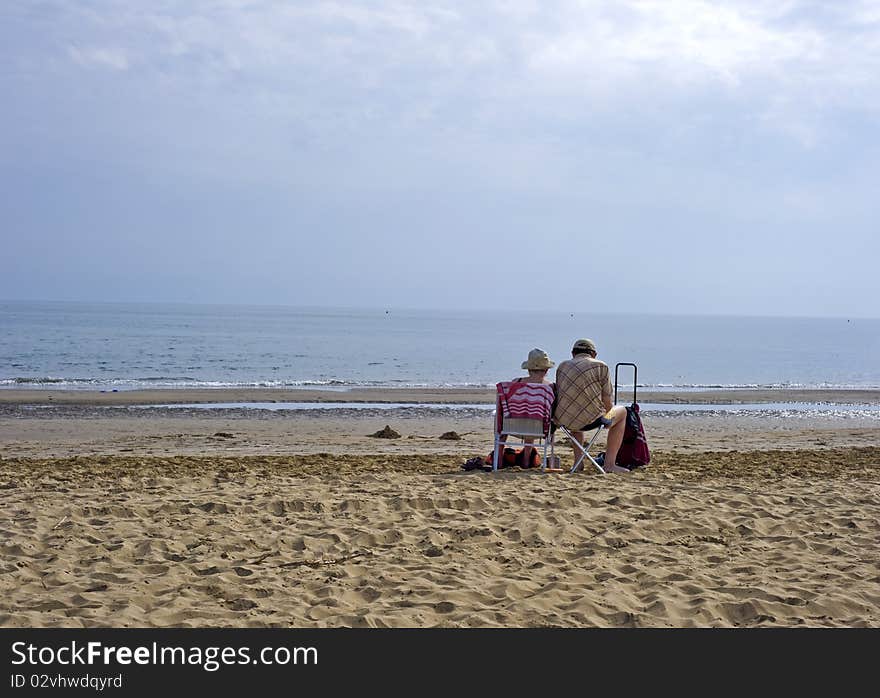 Portrait with old couple staying together on seashore. Portrait with old couple staying together on seashore