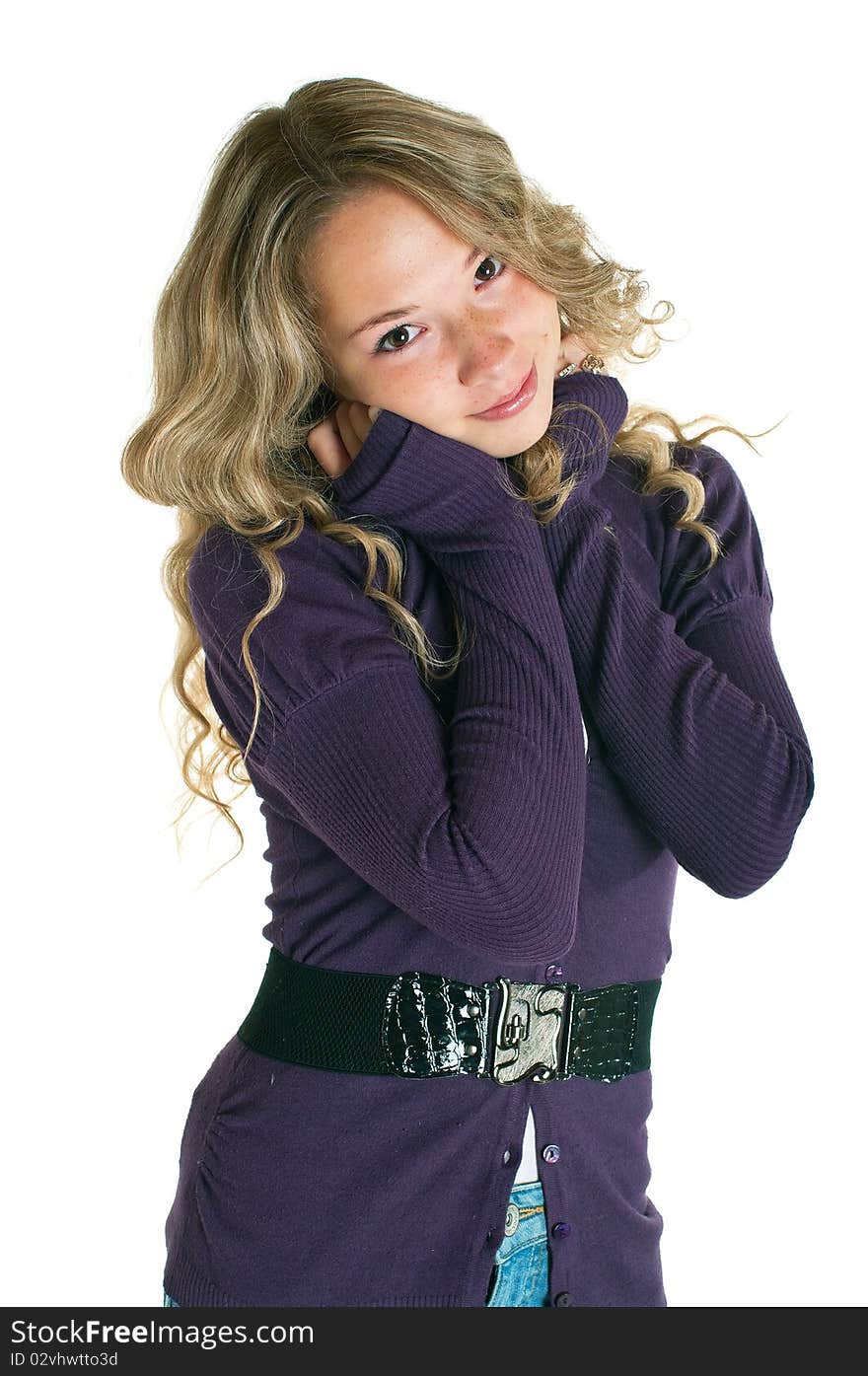 The young beautiful girl in a lilac shirt and jeans skirt. Isolation on a white background