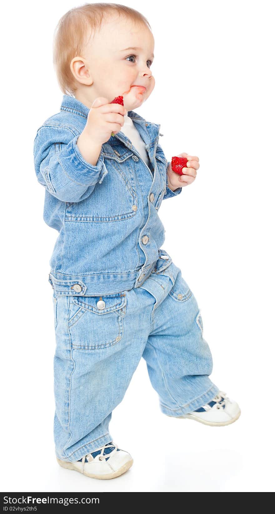 Boy with strawberry. Isolated on white background