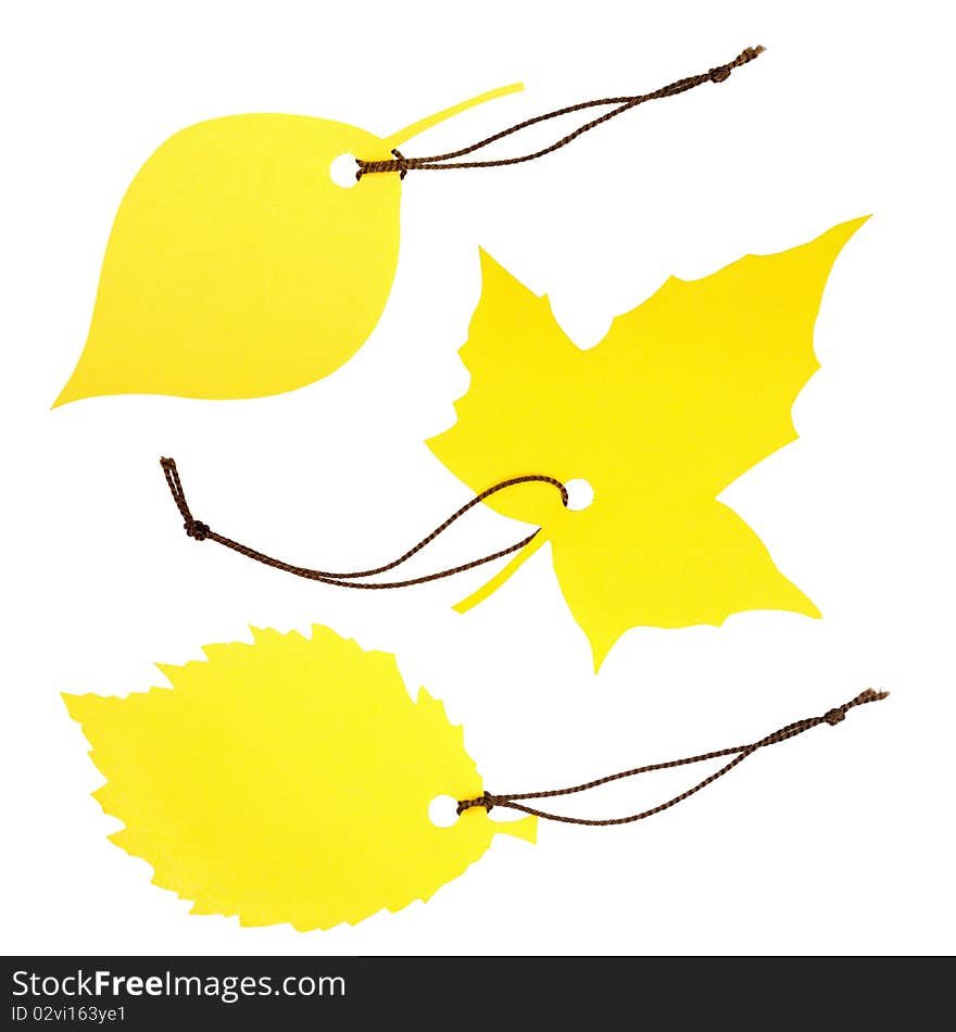 Collage of three yellow leaf-shaped dockets tied with brown string, isolated on white. Collage of three yellow leaf-shaped dockets tied with brown string, isolated on white