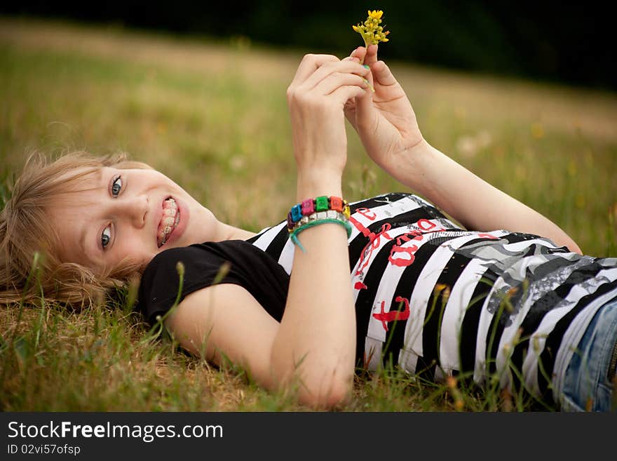 Young summer girl portrait in the grass. Young summer girl portrait in the grass