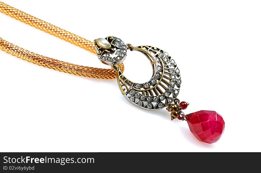 Diamond studded pendant jewellery on white background.