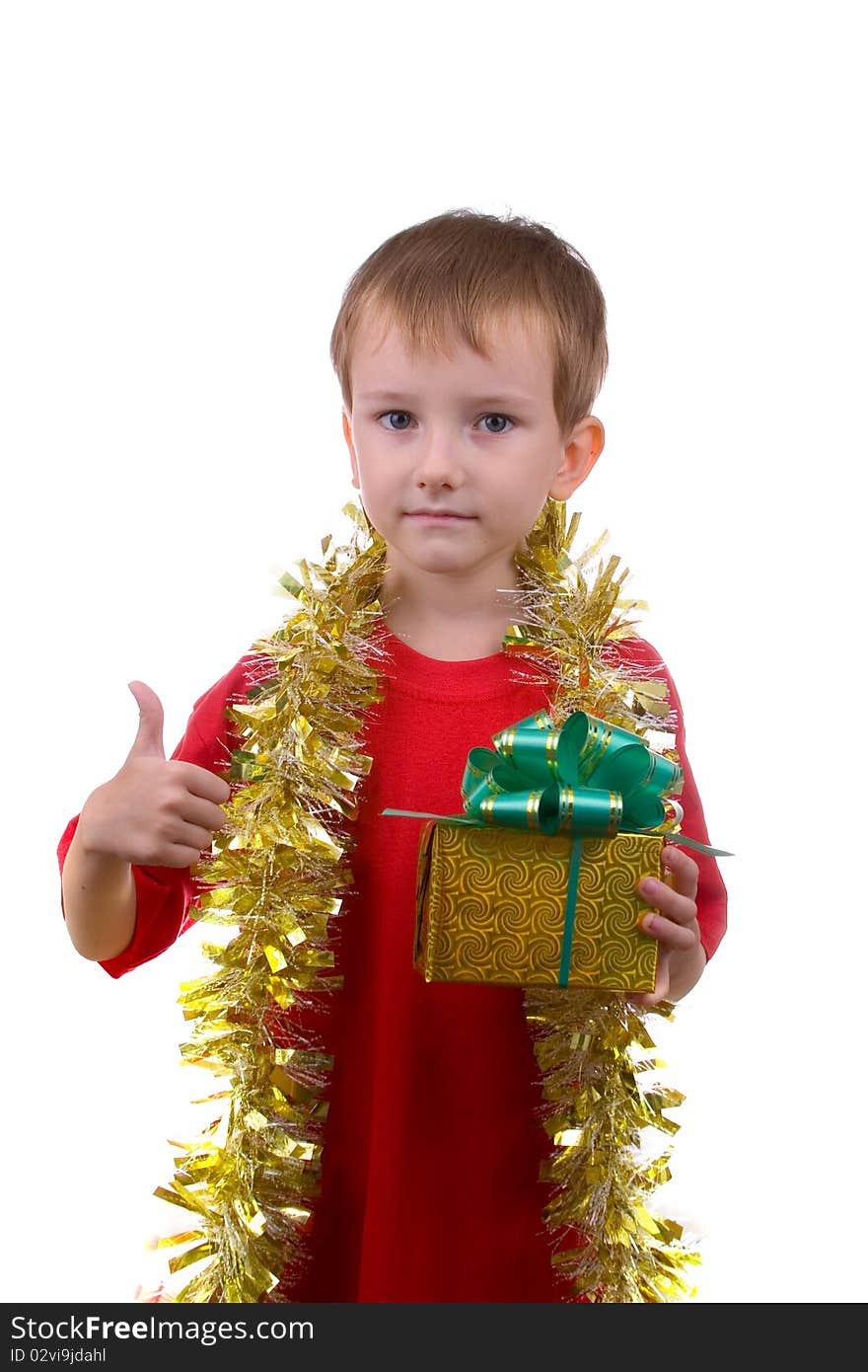 Happy boy with a gift shows the sign of OK, isolated on a white background. Happy boy with a gift shows the sign of OK, isolated on a white background