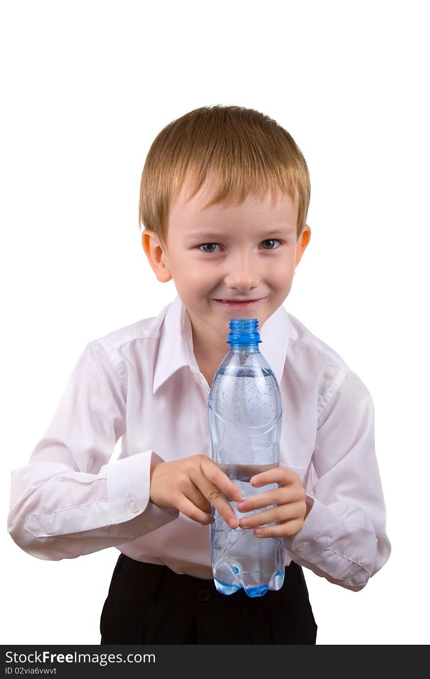 Happy boy with a bottle of water on a white background