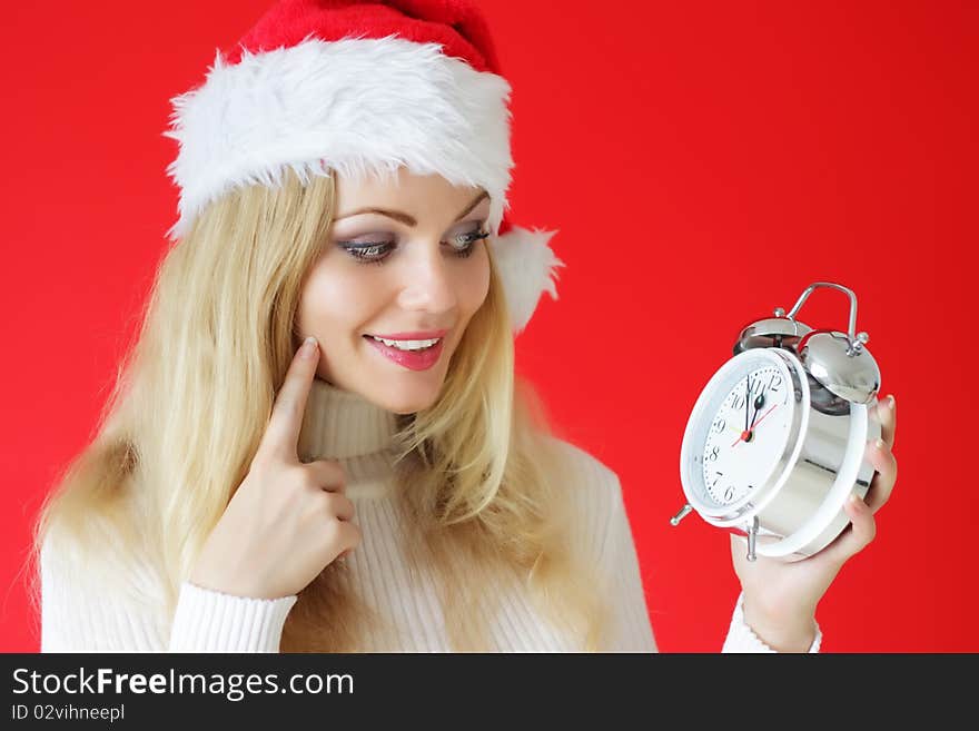 Santa girl holding alarm clock