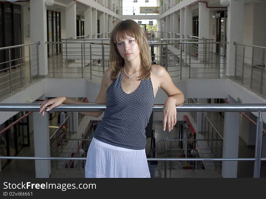 Beaty in a supermarket laying on a chorme railing. Beaty in a supermarket laying on a chorme railing