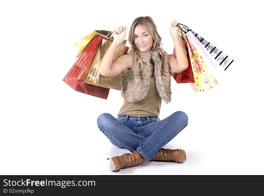 blond woman with shopping bags smiling happily. blond woman with shopping bags smiling happily