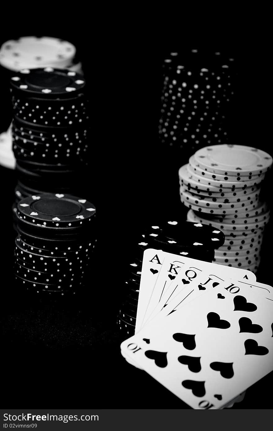 Casino gambling chips and playing cards on green table. Casino gambling chips and playing cards on green table