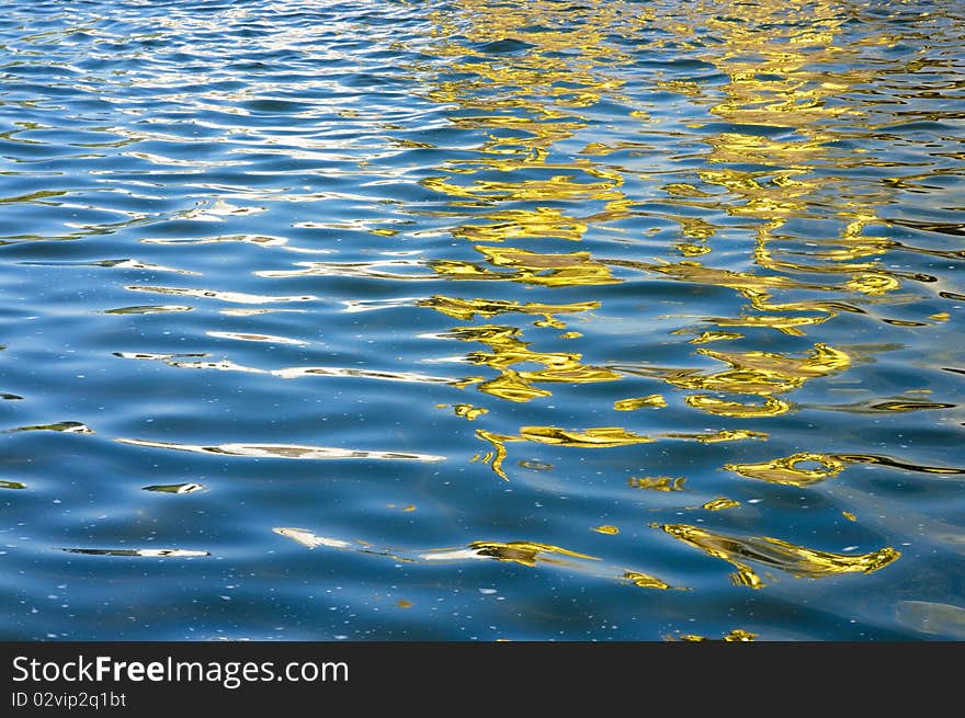 Water surface, the golden reflection