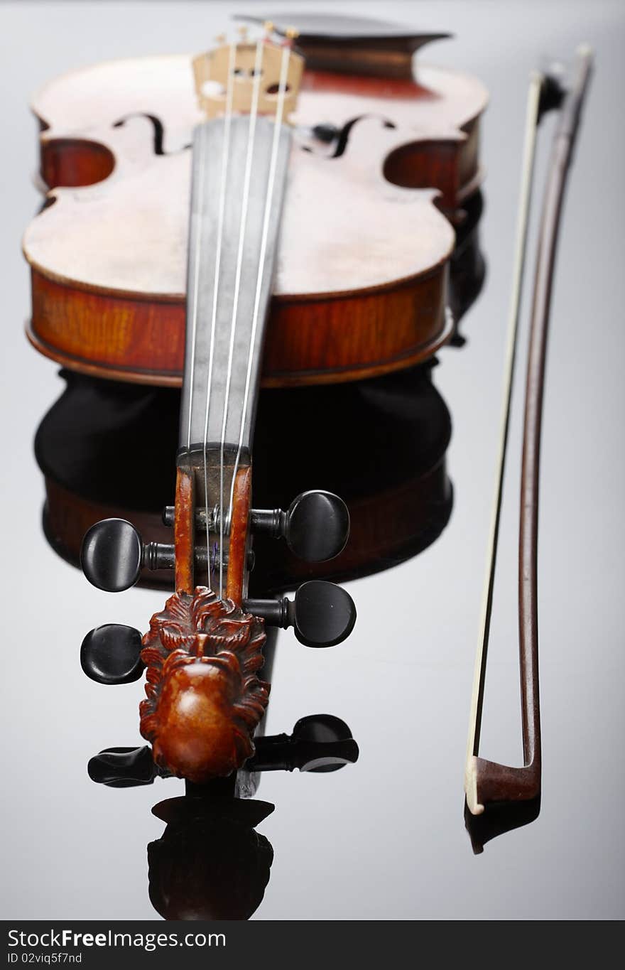 Violin and bow on dark background