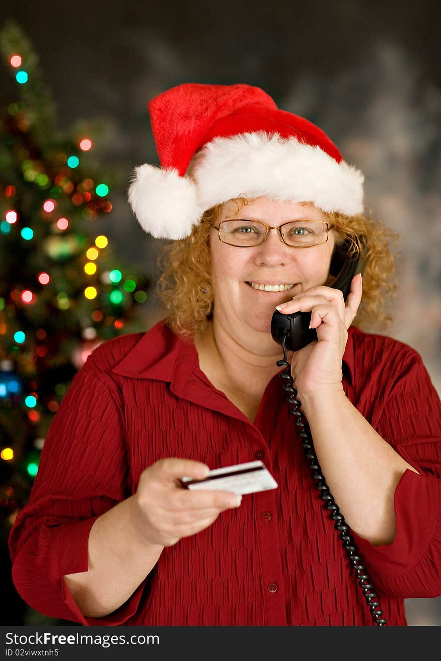 A grandma ordering holiday gifts over phone. A grandma ordering holiday gifts over phone