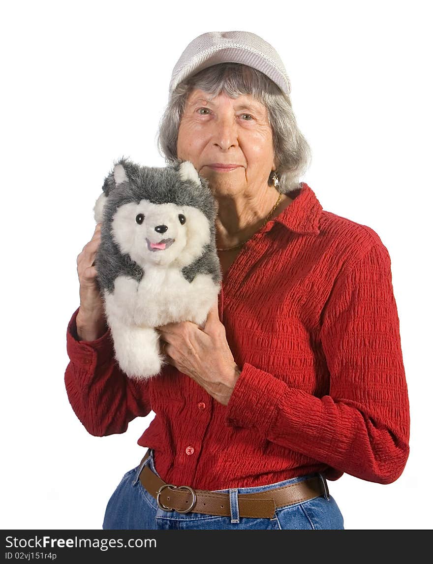 Old senior woman holding stuffed animal. Shot against white background. Old senior woman holding stuffed animal. Shot against white background.