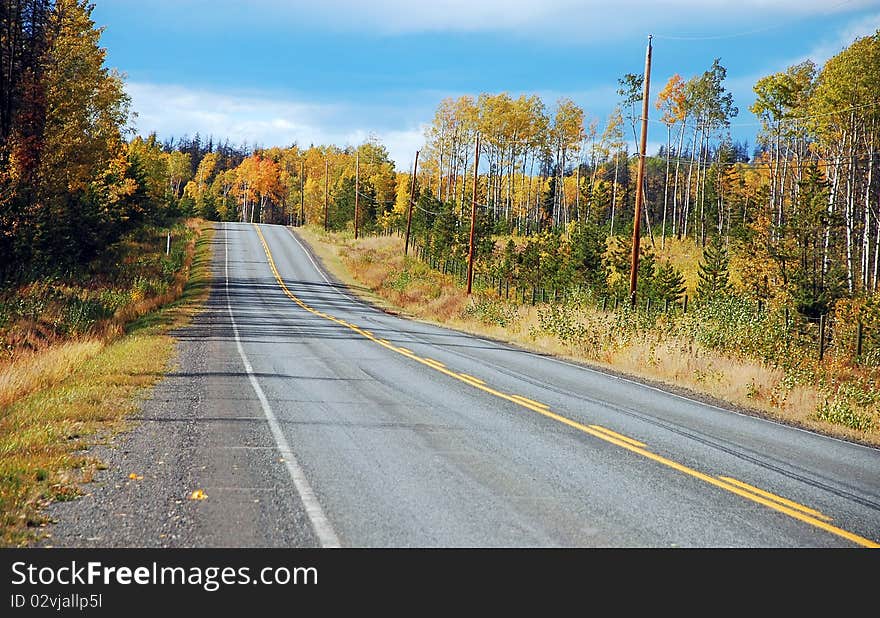 Highway running through colorful countryside in autumn. Highway running through colorful countryside in autumn