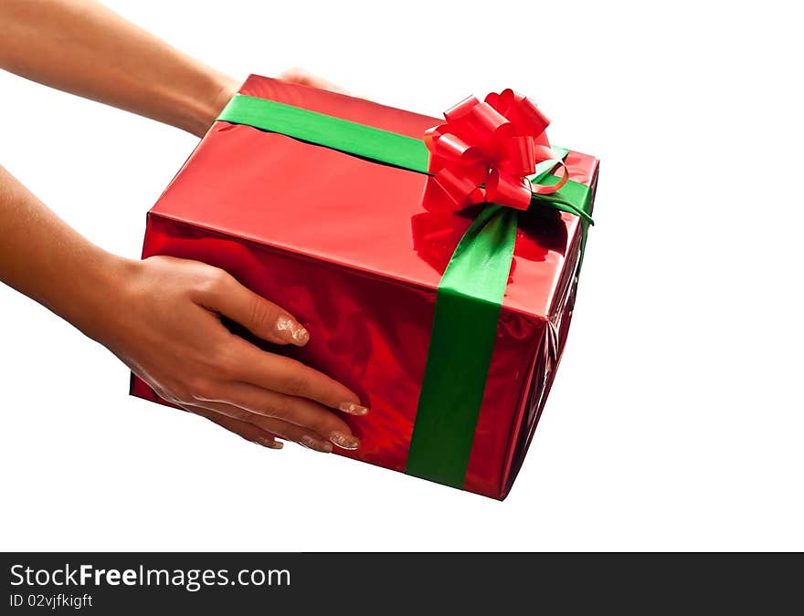 Small red present in woman's hands. Isolated on white background. Small red present in woman's hands. Isolated on white background