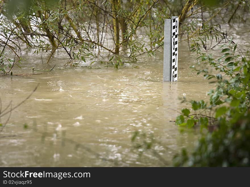 Detail of the flooding water with depth meter.