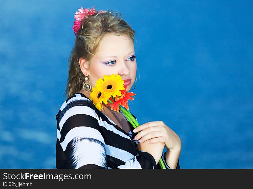 Beautiful woman with flowers in the sea. Beautiful woman with flowers in the sea