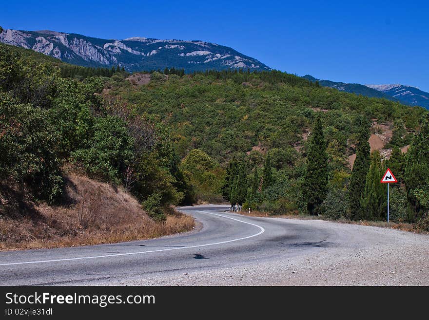 Crimean mountain road on a clear day in summer. Crimean mountain road on a clear day in summer