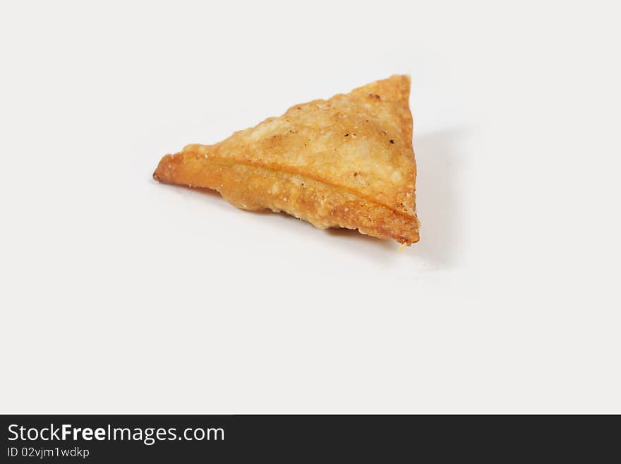 One Bite Indian Punjabi Samosa Close up. One Bite Indian Punjabi Samosa Close up.