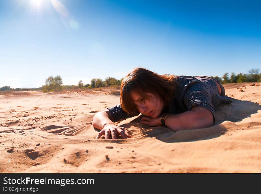 Girl playing with sand 2