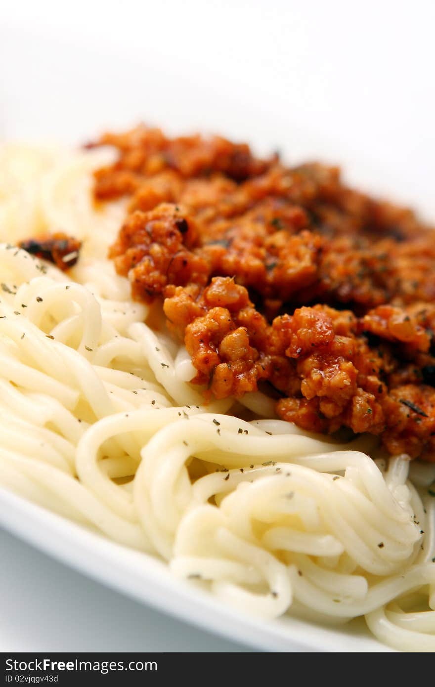 Fresh and tasty pasta with meal on white