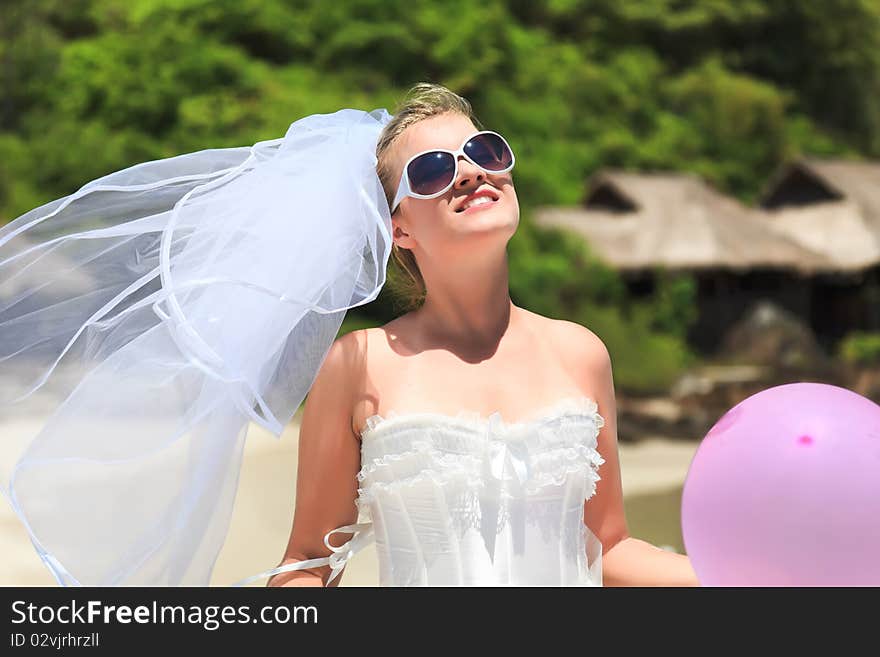 Beautiful young  bride on the tropical beach