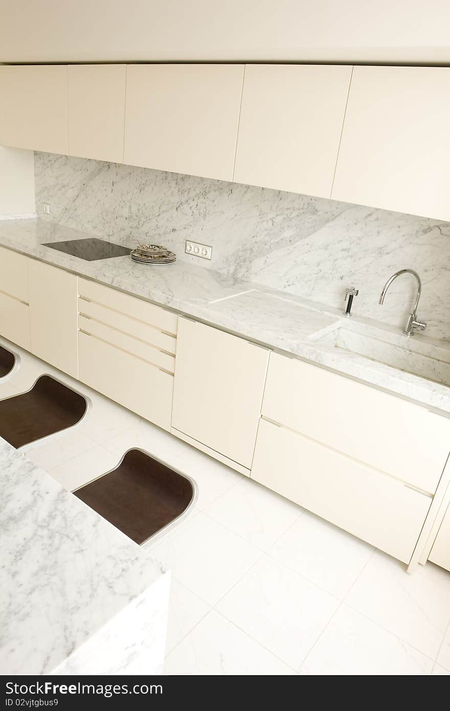 Interior of bright kitchen in white colors