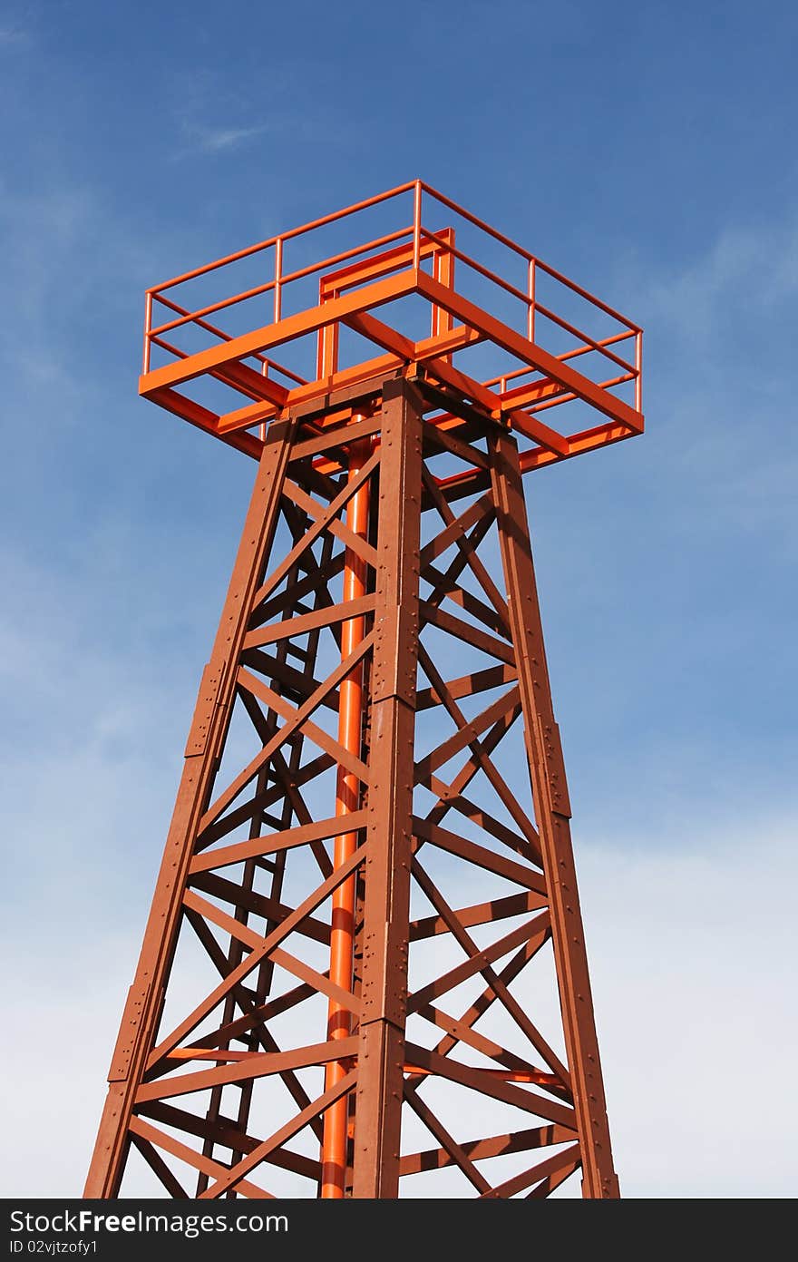 This is the remains of the first oil well in Malaysia.  It was opened in the early 20th century.  It's against a blue sky. This is the remains of the first oil well in Malaysia.  It was opened in the early 20th century.  It's against a blue sky