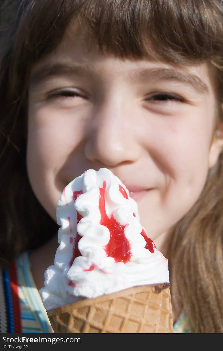 Smiling girl with big ice-cream