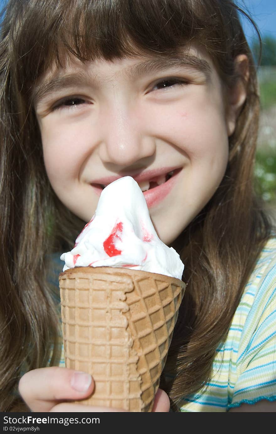 Smiling girl with big cone ice-cream