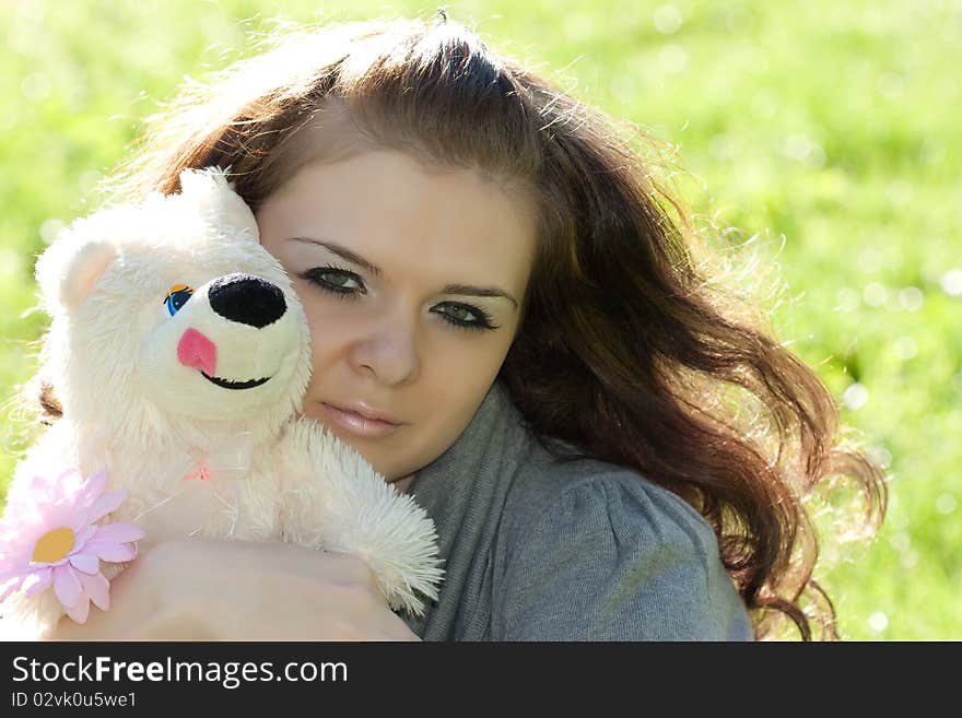 The young woman smiles outdoor. The young woman smiles outdoor