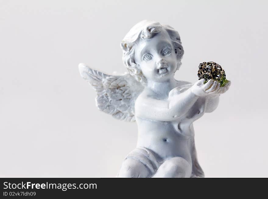 The small figurine of an angel photographed close up