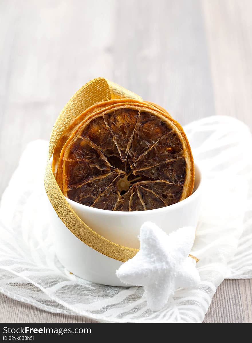 Christmas orange decorated in white bowl