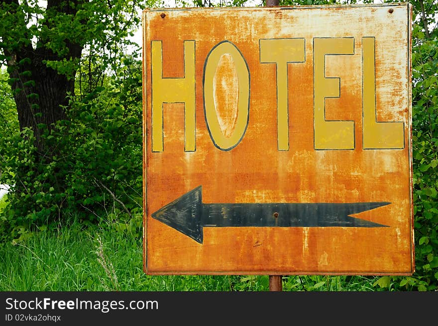 A rusty sign with the inscription HOTEL