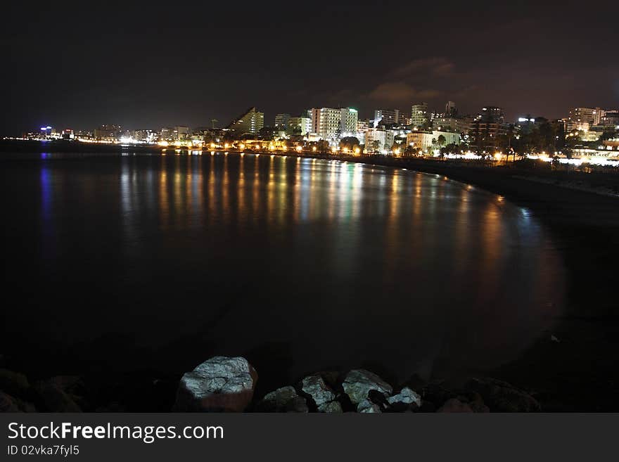 The night scenery Benalmádena represented by the Benalmádena Costa beach and the urban agglomeration on the coast. The night scenery Benalmádena represented by the Benalmádena Costa beach and the urban agglomeration on the coast.