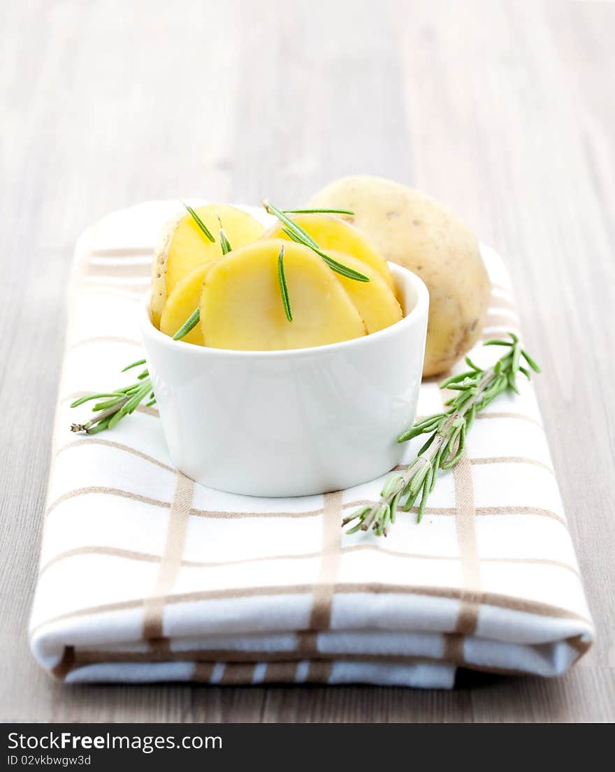 Potato sliced with rosemary