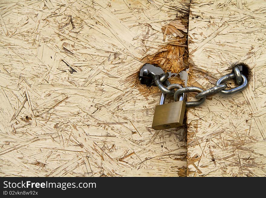 Padlock and chain to close a door