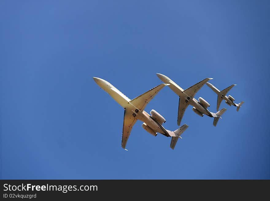 Three aircrafts under a clear blue sky. Three aircrafts under a clear blue sky