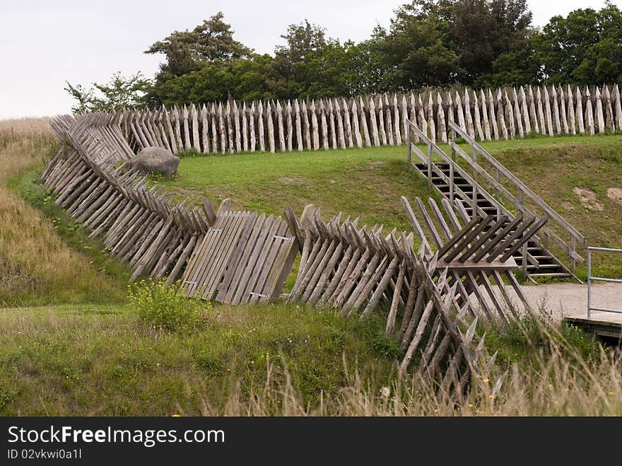 The reconstructed fortifications at Dybboel Banke in Denmark. Wooden palisades all over. The reconstructed fortifications at Dybboel Banke in Denmark. Wooden palisades all over.