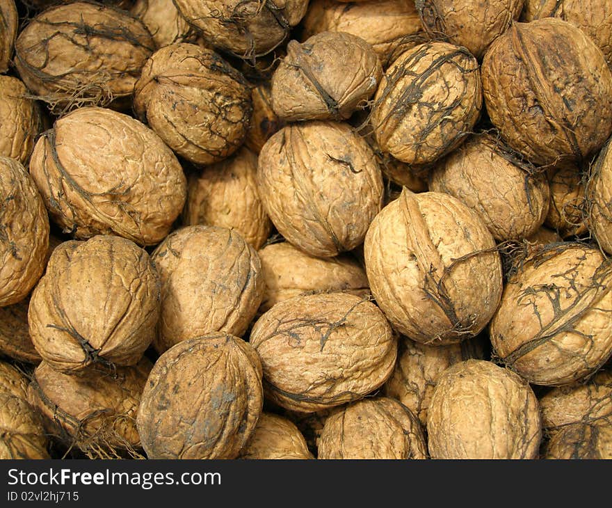 Detail photo texture of the walnuts background. Detail photo texture of the walnuts background